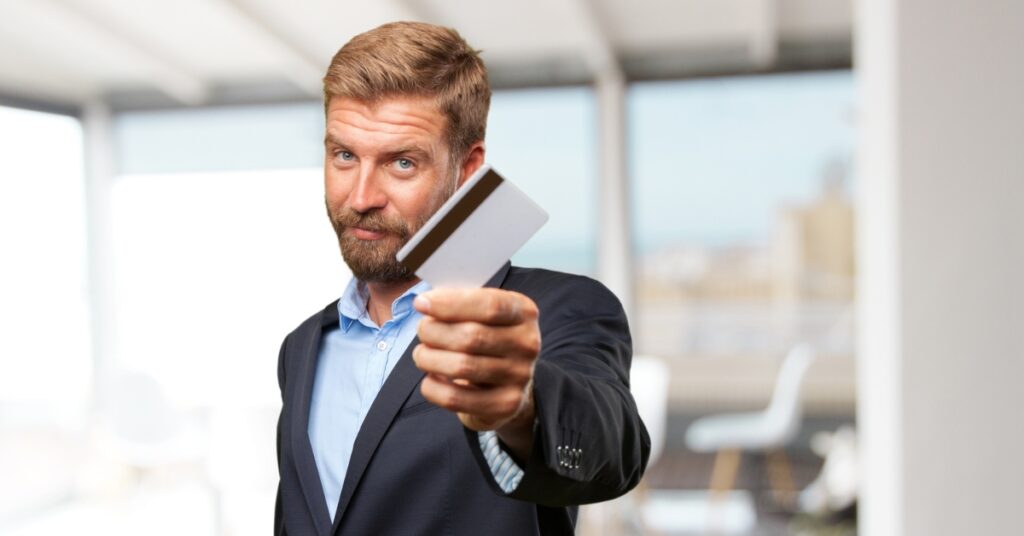 Business man holding Credit Card